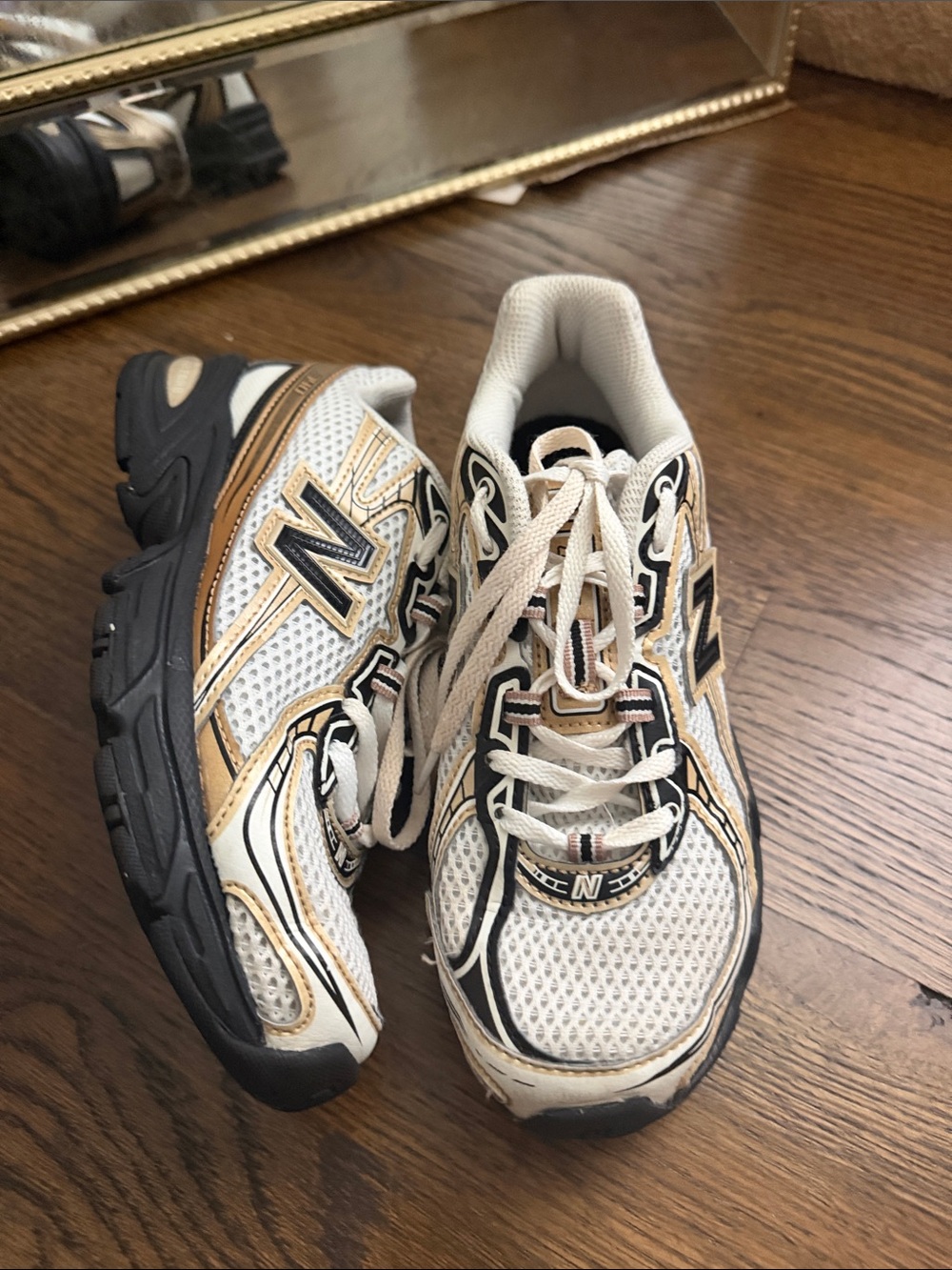 New Balance Kids White, Gold and Black Athletic Sneakers
